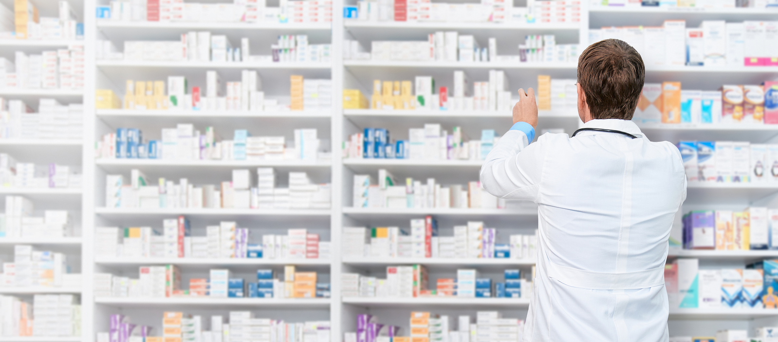 pharmacist looking at shelves