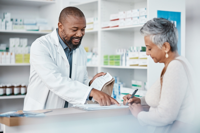 pharmacist giving customer their prescriptions