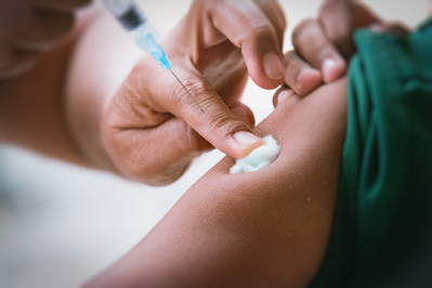 pharmacist giving vaccine